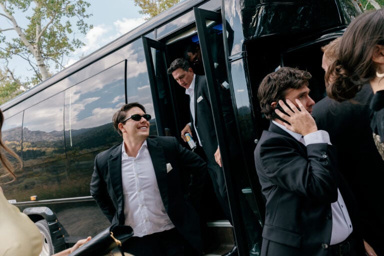 groomsmen exiting Charleston wedding bus